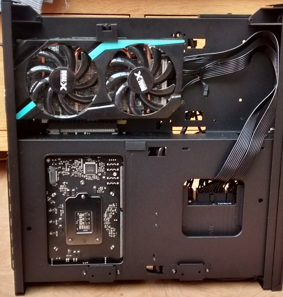 The back of the motherboard and gpu in the new case