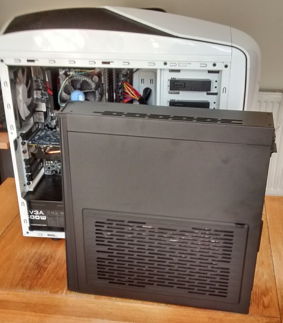 a much smaller PC case in front of a standard mid-tower